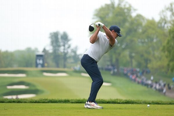 Koepka toughs through rainy round to take lead